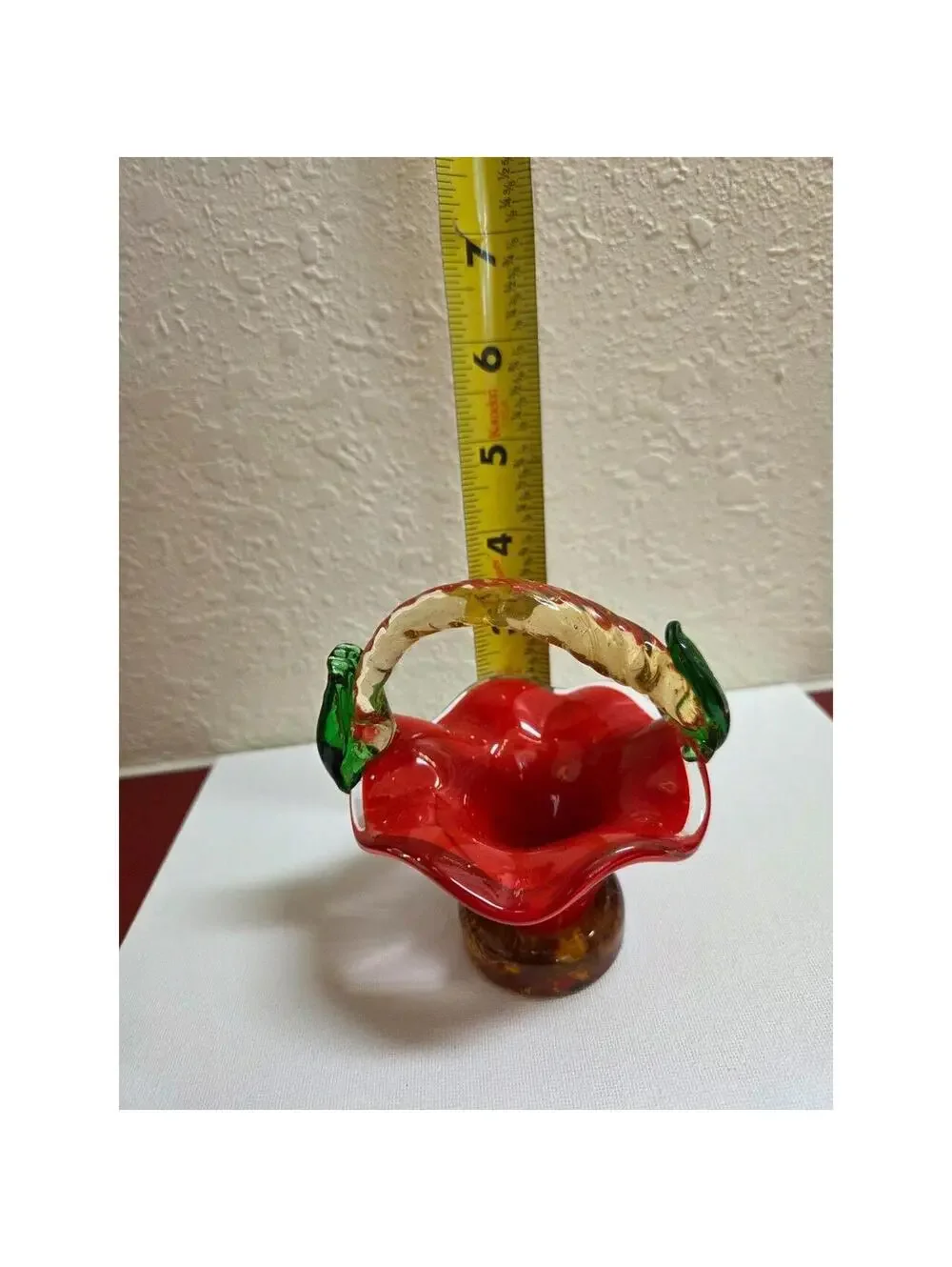 Vintage hand blown art Glass basket. Red, tan and green in color.